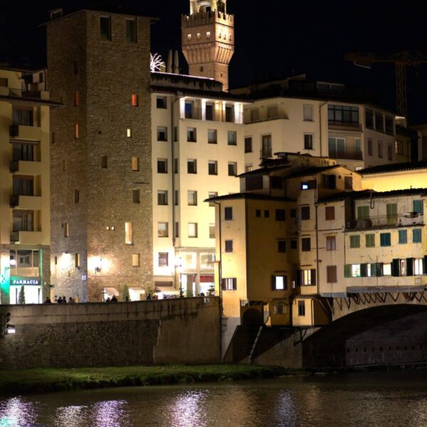 Stunning night view of Ponte Vecchio and surrounding architecture in Florence, Italy.