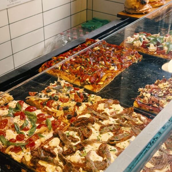 Roman Pizza Freshly baked Italian pizzas on display in a traditional pizzeria in Rome, Italy.