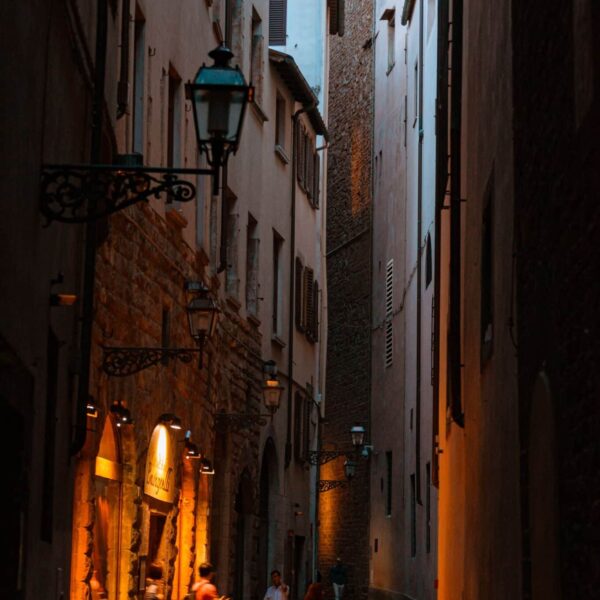 Explore the enchanting narrow streets of Florence at twilight, capturing Tuscany's classic architecture.