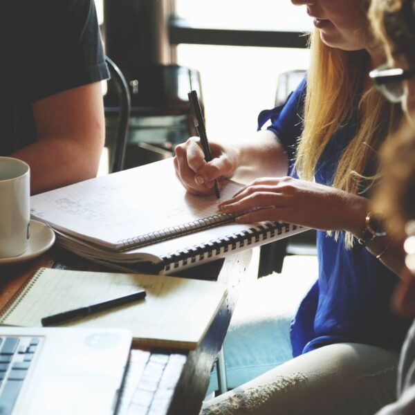 Lesson A group of young adults working together on a project at a casual meeting.
